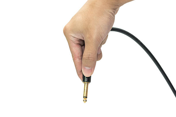 istock holds mono jack for electroguitar in the hand 3 484915554