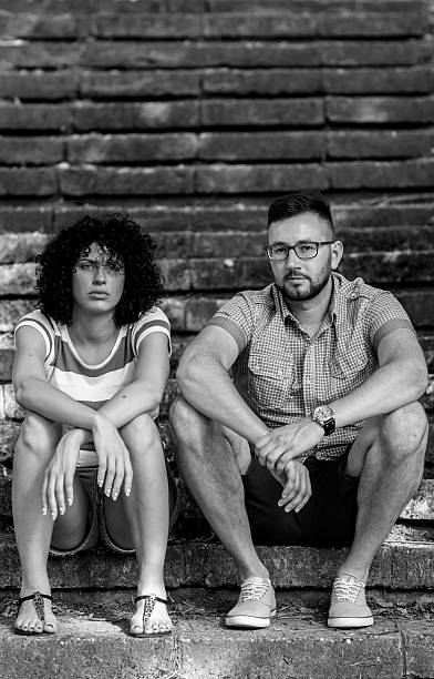 istock Young stylish couple looking serious outside 484917488