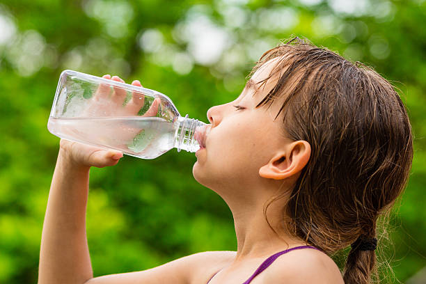 istock Child drinking clean tap water from transparent plastic bottle 484917812