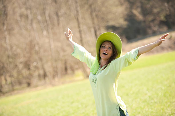 istock Attractive mature woman enjoying spring nature 484918276