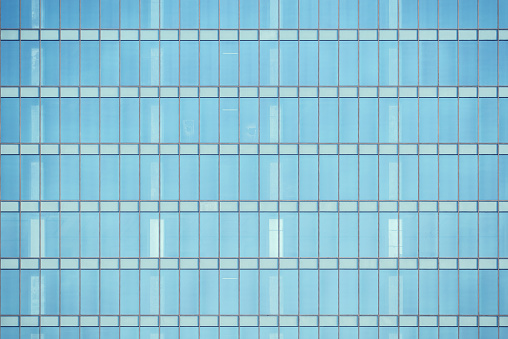 Office building wall in the business city center at sunset time.