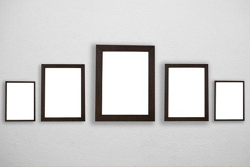 Blank black frame attached to a buildings wall.