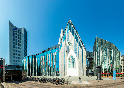 Leipzig, Germany - August 4, 2015: Erick van Egeraat built the modern University hall in 2008 at Augustus Square in Leipzig. Design was a  reminiscent of the 15th century  Church.