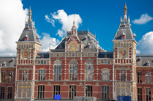 Facade of the Amsterdam Centraal Station in sunny day, Netherlands.