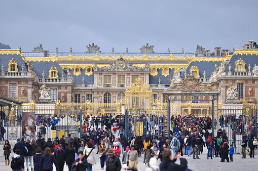 Versailles, France - March 31, 2015: Many tourists are waiting to visit Versailles Palace, France