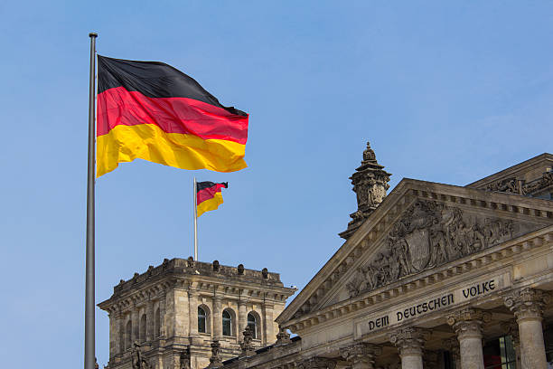 istock German flag on Reichstag building in Berlin: German parliament 484928706