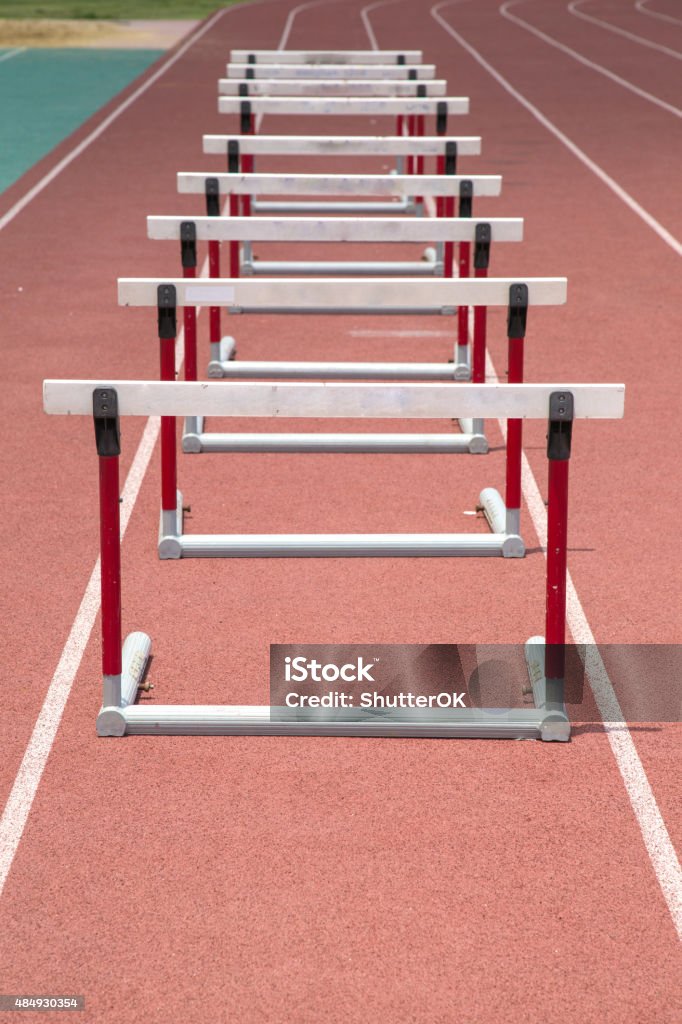 hurdles on the red running track prepared hurdles on the red running track prepared for competition Hurdle Stock Photo