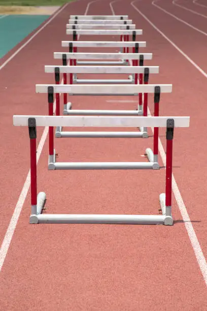 hurdles on the red running track prepared for competition