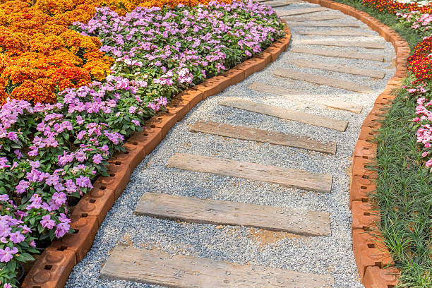 istock Walkway in flower garden 484931312
