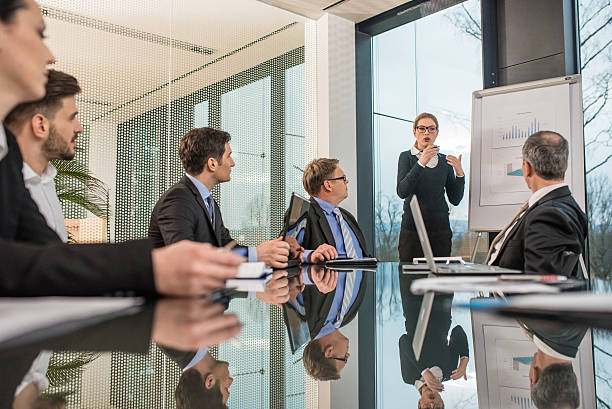 istock Woman leading meeting in conference room 484932206