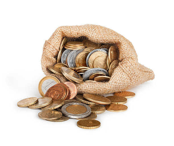 istock Gold coins fall out of a canvas bag 484935528