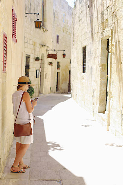 istock Girl looking for directions on phone map 484935876