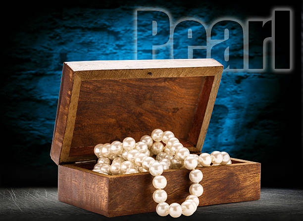 istock Wooden chest with white pearl necklace 484936010