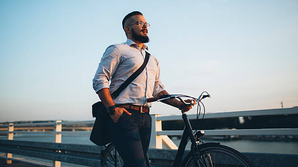 istock Businessman Pushing Bicycle and going home late. 484936760