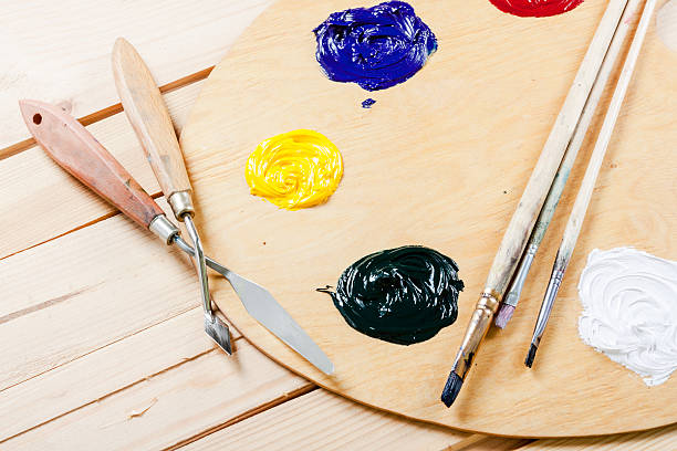 istock Palette with oil paint and brushes 484943358