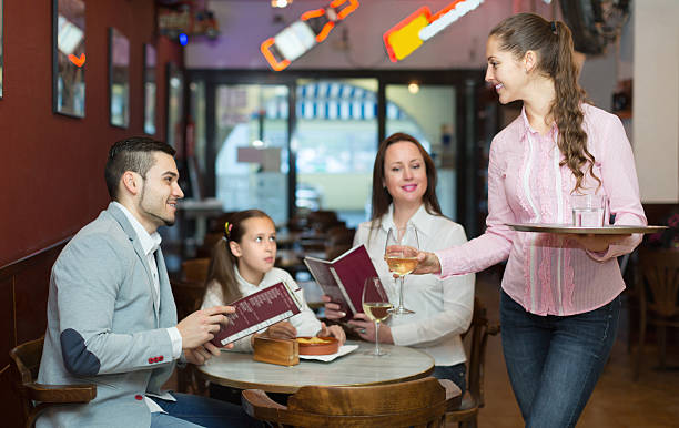 istock Waitress and family at cafe 484943656