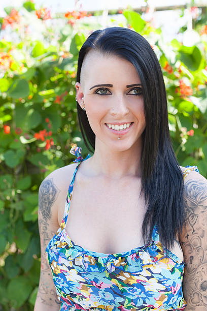 istock Shaven Headed Lady In A Summer Dress 484945412