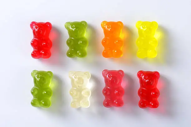 multicolored gummy bears isolated on white background