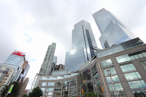 New York City, United States - July 4, 2013: Architecture view of Columbus Circle in New York. Columbus Circle with famous Time Warner Center skyscrapers completed in 2003 is one of New York landmarks.