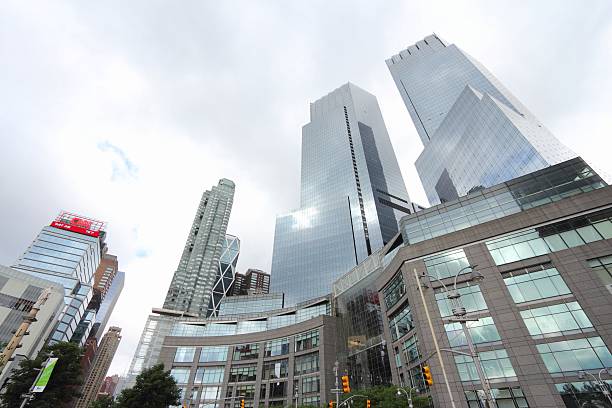 Columbus Circle New York City, United States - July 4, 2013: Architecture view of Columbus Circle in New York. Columbus Circle with famous Time Warner Center skyscrapers completed in 2003 is one of New York landmarks. time warner center columbus circle pictures stock pictures, royalty-free photos & images