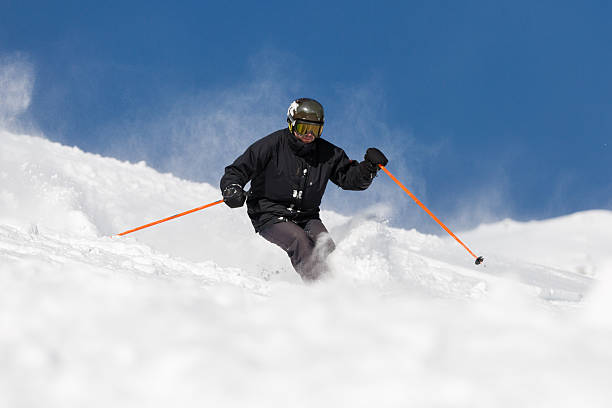 istock Skier skiing on ski slope 484948534