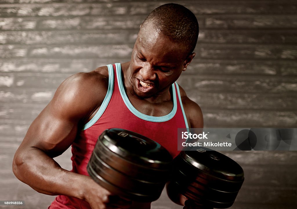 He eats dumbbells for breakfast Shot of a man working out with dumbbells at the gymhttp://195.154.178.81/DATA/i_collage/pu/shoots/805401.jpg 2015 Stock Photo