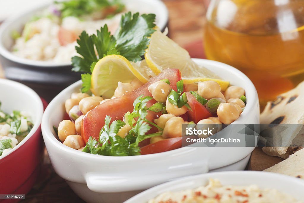 Chickpea salad Chickpea salad with hummus and couscous, classic middle eastern food Bean Stock Photo