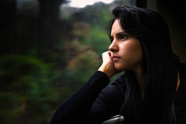 istock Fragility, pensive young woman traveling on a train 484948825