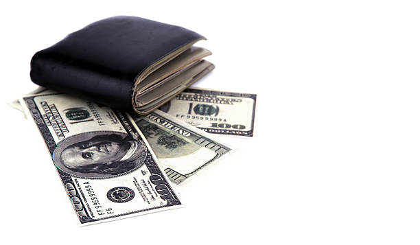 istock Old black wallet with dollar  isolated on white background 484949141