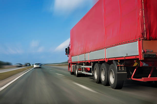 istock red trailer on the highway 484950753