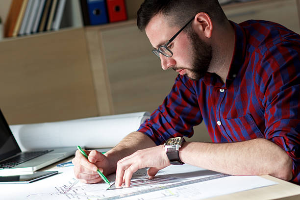 istock Young designer working on new project in office 484950808