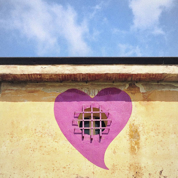 Ghezzano, Italy - April 9, 2014: It's a house window but it may even look like a prison's one. This small countryside home is situated in via Lazzeri, Ghezzano, municipality of San Giuliano Terme, Tuscany.
