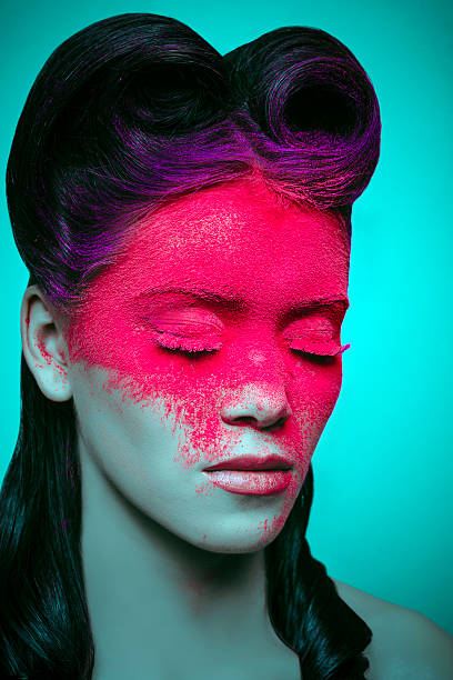 woman portrait with retro hairstyle and magenta powder makeup on her face.