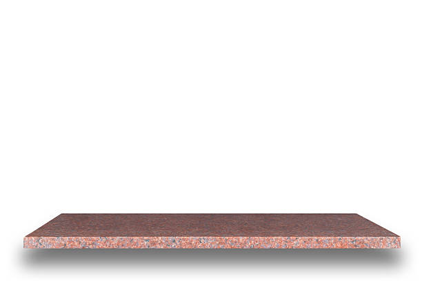 istock Empty top of natural stone shelves isolated on white background 484951044