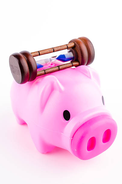 istock piggy bank sand clock isolated white background 484951485
