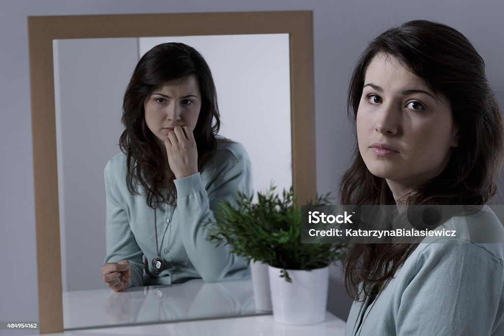 Woman with emotional problem Worried and scared young woman with emotional problem 2015 Stock Photo