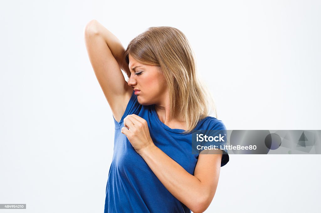 Unpleasant smell under armpit Young woman is sweating to much and she doesn't like her smell under armpit. Armpit Stock Photo