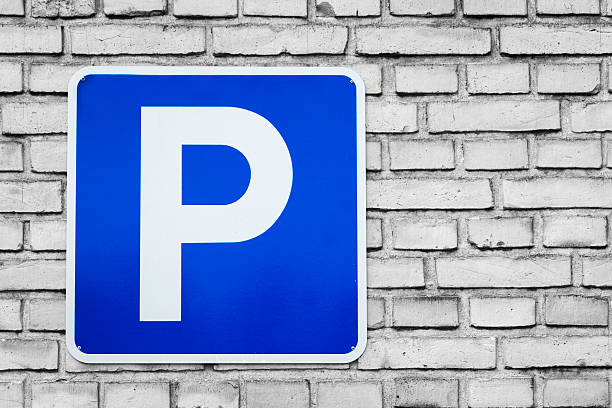 istock Blue parking sign on black and white bricks 484954958