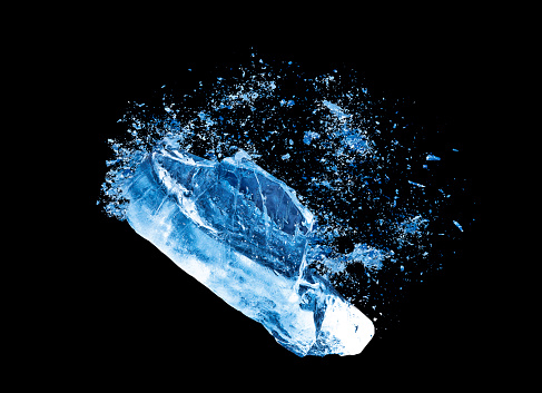 Abstract blue Ice crash explosion parts on black background. Collision, suspension crystal ice cubes damage.
