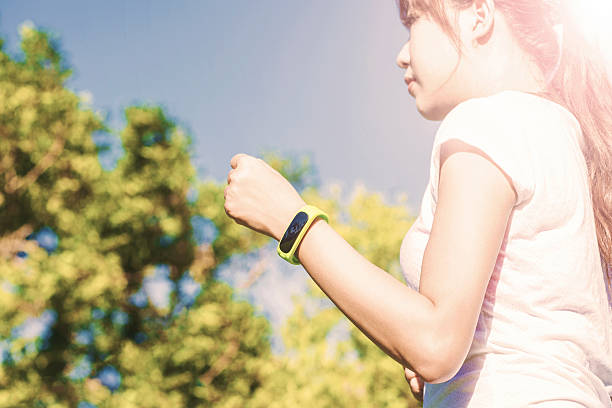 istock woman run and look wear smart watch device 484959526