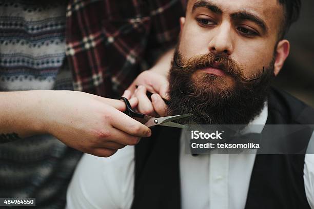 Barber Shaves A Bearded Man Stock Photo - Download Image Now - 2015, Adult, Adults Only