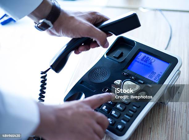 Dialing Telephone Keypad Making A Call Stock Photo - Download Image Now - Endorsing, Hotel Reception, Receptionist