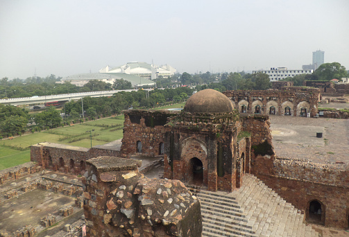 Indraprastha Stadium visible behind the ruins of Feroz Shah Kotla Fort, Delhi, India