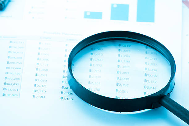 istock Document financial with magnifying glass.searching profit 484966500