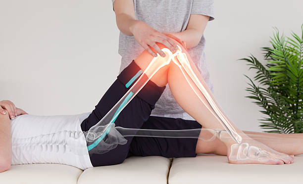 Highlighted bones of woman at physiotherapist Digital composite of Highlighted bones of woman at physiotherapist chiropractor treatment stock pictures, royalty-free photos & images