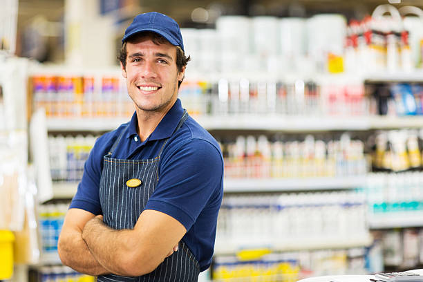 istock male supermarket worker with arms crossed 484968518