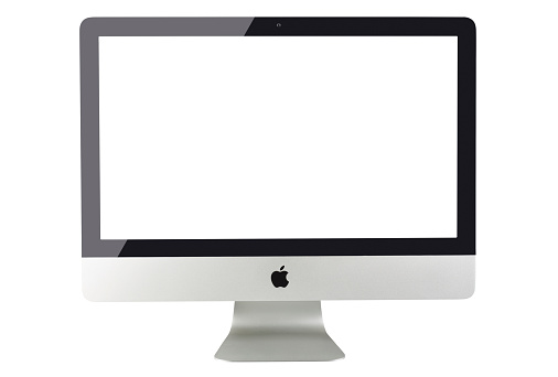 Istanbul, Turkey - August 11, 2015: Apple iMac 27 inch desktop computer displaying blank white screen on a white background. iMac produced by Apple Inc.