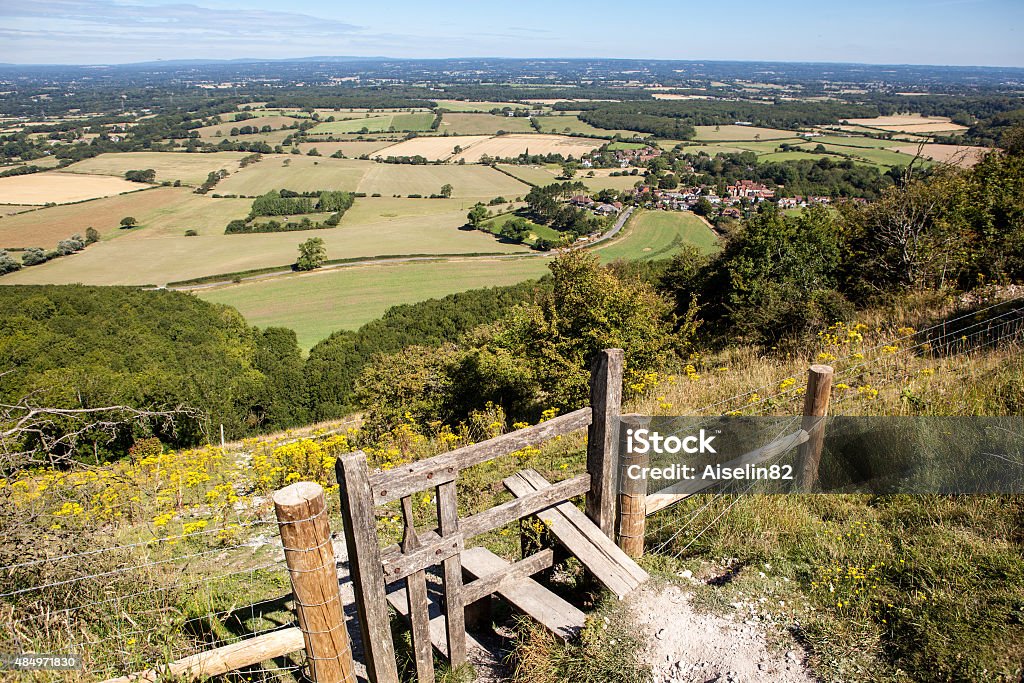 View of the South Downs way, East Sussex, England View of the South Downs way, East Sussex, England: view of the fields and the houses from the hill South Downs Stock Photo