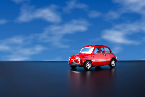 Izmir, Turkey - August 20, 2015 Old Fiat 500 toy car product shot on a blue sky background