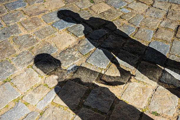 istock Shadows of a two children 484977482